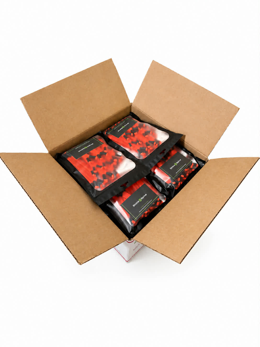 Open cardboard box containing our Solar Ember Orange Shine Spine branch spreaders on a white background.